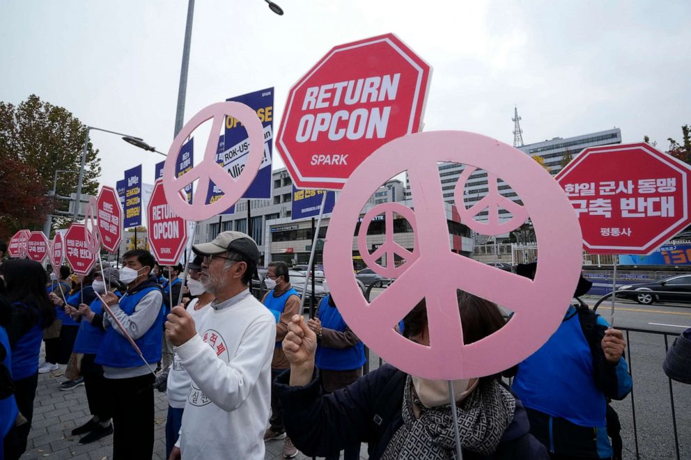 PHOTO: Protesters stag a rally to demand peace on the Korean peninsula in front of the presidential office in Seoul, South Korea, Thursday, Nov. 3, 2022.