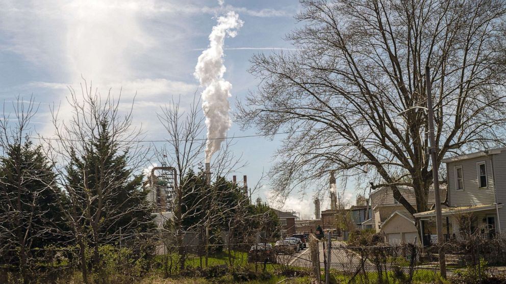 PHOTO: A plume of smoke rises above residential and commercial buildings from the Delaware City Refinery, on April 11, 2022 in New Castle, Dela.