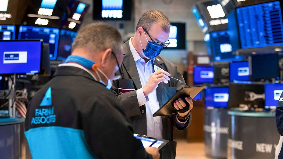 Traders working New York Stock Exchange