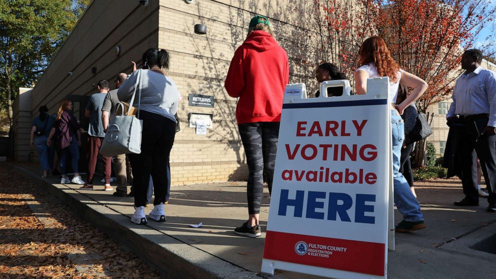 PHOTO: People wait in line for early voting for the midterm elections at Ponce De Leon Library on Nov. 4, 2022 in Atlanta.