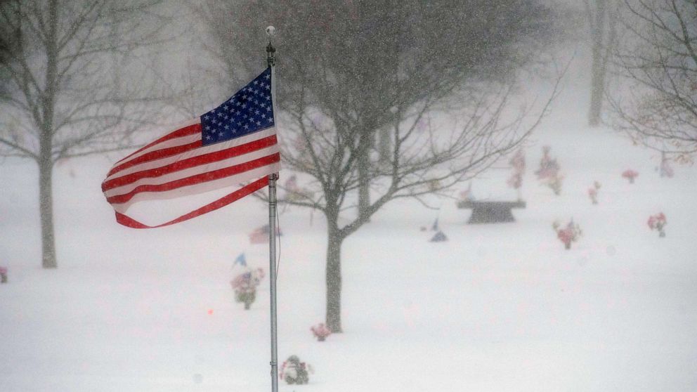 PHOTO: FILE - Wind gusts as strong as 26 mph blow a ripped American flag as a snowstorms howls through in Lincoln, Neb, Feb. 16, 2023.