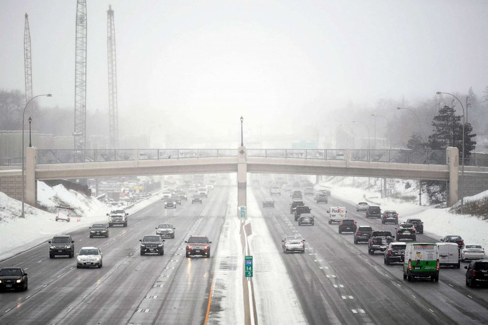 PHOTO: Traffic is moving on interstate 35W during a snowstorm in Minneapolis, Feb. 22, 2023.