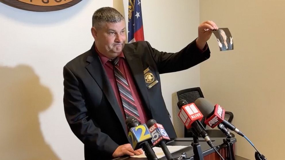 PHOTO: Douglas County Sheriff Capt. Jon Mauney holds up a photo of AJ'anaye Hill a child who was shot to death outside a house party Saturday night in the Atlanta suburb of Douglasville, Georgia.