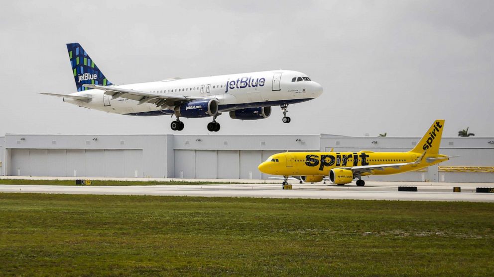 PHOTO: JetBlue and Spirit airplanes at Fort Lauderdale-Hollywood International Airport in Fort Lauderdale, Fla., May 21, 2022.