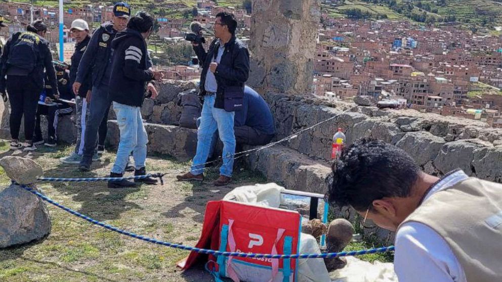 PHOTO: Puno TV shows members of the Decentralized Directorate of Culture of Puno and the police investigating the founding of a mummy inside a cooler box used by a delivery service worker in Puno, Peru.