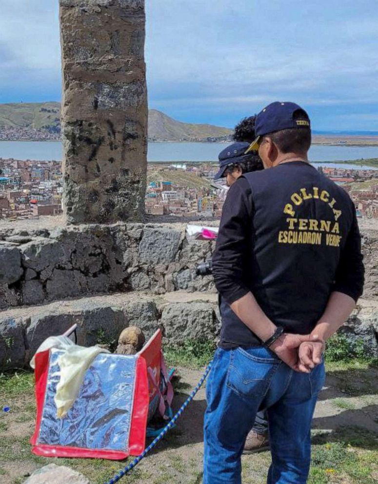 PHOTO: Puno TV shows members of the Decentralized Directorate of Culture of Puno and the police investigating the founding of a mummy inside a cooler box used by a delivery service worker in Puno, Peru.