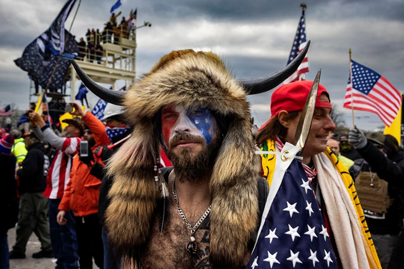 WASHINGTON, DC - JANUARY 6: Jacob Anthony Angeli Chansley, known as the QAnon Shaman, is seen at the Capital riots. On January 9, Chansley was arrested on federal charges of "knowingly entering or remaining in any restricted building or grounds without lawful authority, and with violent entry and disorderly conduct on Capitol grounds"Trump supporters clashed with police and security forces as people try to storm the US Capitol on January 6, 2021 in Washington, DC. Demonstrators breeched security and entered the Capitol as Congress debated the 2020 presidential election Electoral Vote Certification. (photo by Brent Stirton/Getty Images)