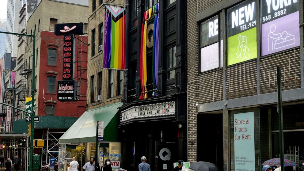PHOTO: Pride flags hang outside of Q NYC bar in the Hell's Kitchen neighborhood of New York, June 22, 2022.