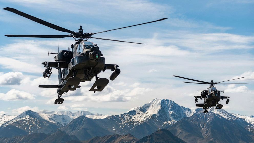 PHOTO: AH-64D Apache Longbow attack helicopters from the 1st Attack Battalion, 25th Aviation Regiment, fly over a mountain range near Fort Wainwright, Alaska, June 3, 2019.
