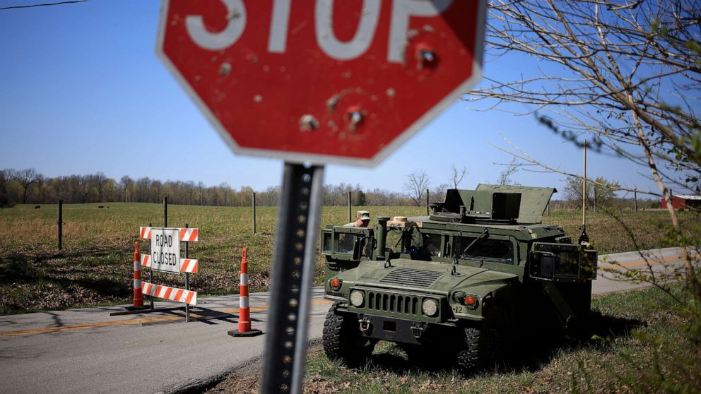 PHOTO: CADIZ, KY - MARCH 30: A Humvee from the U.S. Army's 101st Airborne Division sits parked at a checkpoint near the site where two UH-60 Blackhawk helicopters crashed on March 30, 2023 in Cadiz, Kentucky.