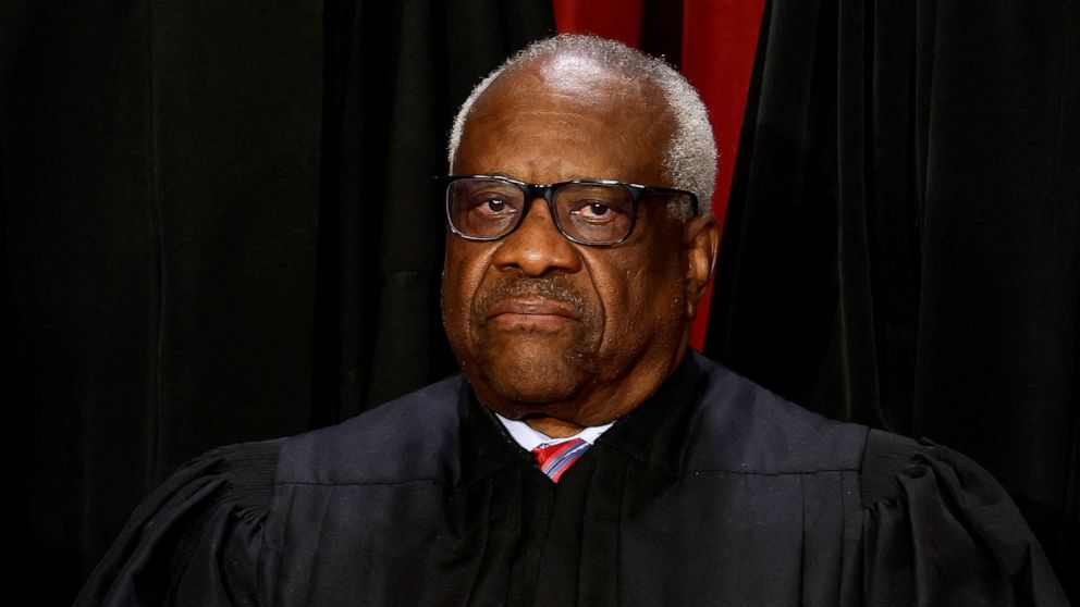 PHOTO: Supreme Court Associate Justice Clarence Thomas poses during a group portrait at the Supreme Court in Washington, October 7, 2022.