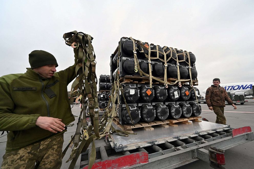 PHOTO: Ukrainian servicemen unload a Boeing 747-412 plane with the FGM-148 Javelin, American man-portable anti-tank missile provided by US to Ukraine as part of a military support, at Kyiv's airport Boryspil, Feb. 11,2022.