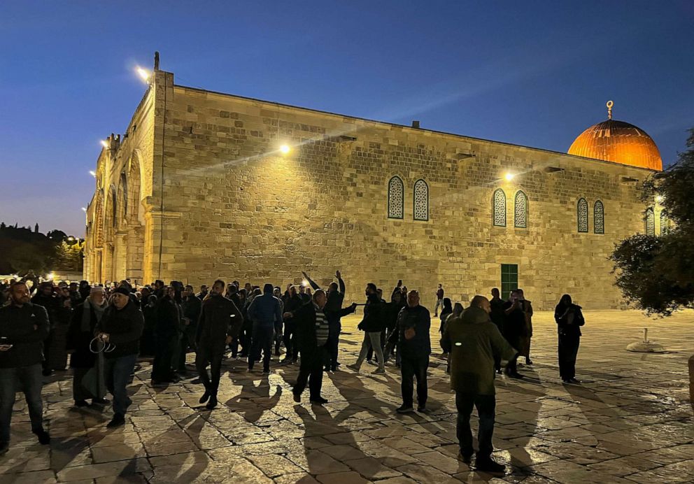 PHOTO: Palestinians shout slogans at Israeli security forces at the Al-Aqsa Mosque compound in Jerusalem, on April 5, 2023.