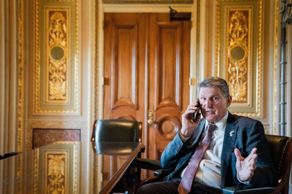 PHOTO: Sen. Joe Manchin talks on the phone with a staffer in the Senate Reception room of the U.S. Capitol, April 18, 2023, in Washington.