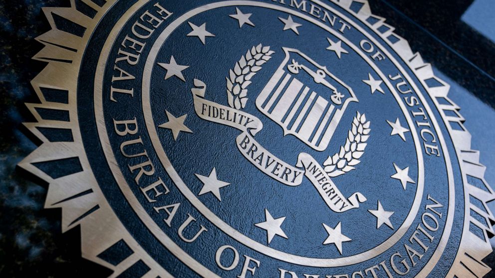 PHOTO: A seal reading "Department of Justice Federal Bureau of Investigation" is displayed on the J. Edgar Hoover FBI building in Washington, DC, on August 9, 2022.