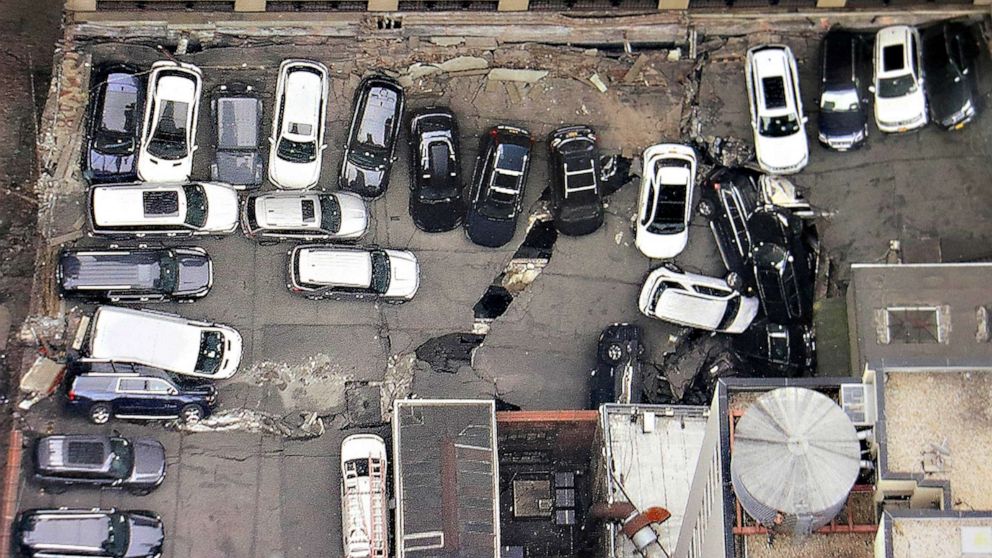 PHOTO: Cars are seen at the partial collapse of a parking garage in the Financial District of New York, April 19, 2023, in New York.