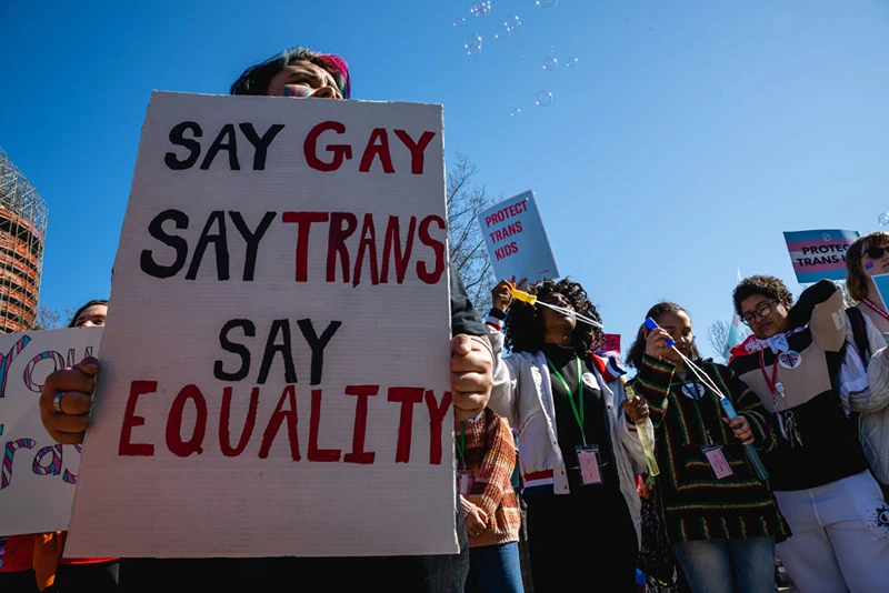 A person with a sign attends a rally to protest the passing of SB 150 on March 29, 2023 at the Kentucky State Capitol in Frankfort, Kentucky. SB 150, which was proposed by State Senator Max Wise (R-KY), is criticized by many as a "Don't Say Gay" bill and was vetoed by Kentucky Governor Andy Beshear during the General Assembly. Lawmakers may override this veto, passing the bill into law. (Photo by Jon Cherry/Getty Images)