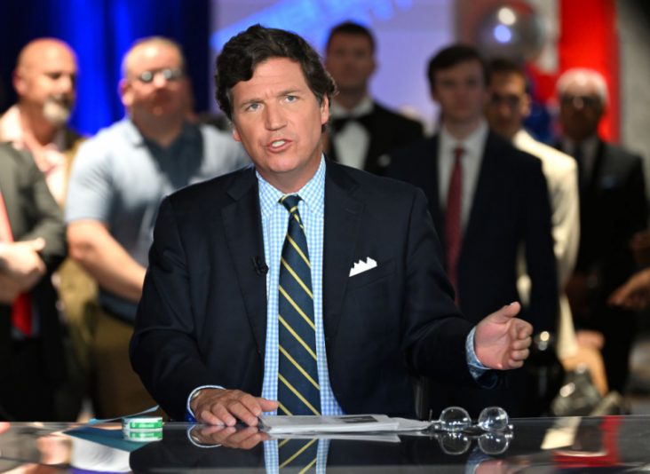 HOLLYWOOD, FLORIDA - NOVEMBER 17: Tucker Carlson speaks during 2022 FOX Nation Patriot Awards at Hard Rock Live at Seminole Hard Rock Hotel & Casino Hollywood on November 17, 2022 in Hollywood, Florida. (Photo by Jason Koerner/Getty Images)