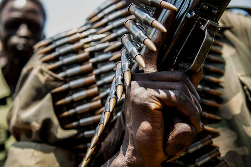 TOPSHOT - Rebels of the Sudan People's Liberation Movement-in-Opposition (SPLM-IO), a South Sudanese anti-government force, hold ammunitions which they say were confiscated from government forces during fighting as they take part in a military exercise on September 22, 2018, at their base in Panyume, South Sudan, near the border with Uganda. - Despite a peace deal being signed by the President of South Sudan, Salva Kiir, and opposition leader Riek Machar on September 12, conflict in Central Equatoria continues as both warring parties fight for control. (Photo by SUMY SADURNI / AFP) (Photo by SUMY SADURNI/AFP via Getty Images)