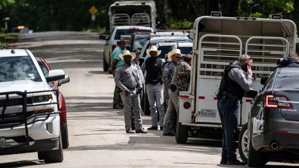 PHOTO: Law enforcement search for the suspect a few miles from the scene where five people, including an 8-year-old child, were killed after a shooting inside a home, April 29, 2023 in Cleveland, Texas.