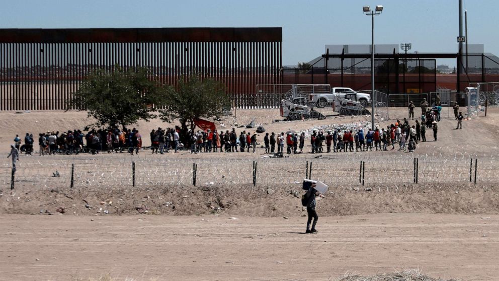 PHOTO: Migrants line up after being detained by US authorities at the US-Mexico border in Ciudad Juarez, Mexico, on April 30, 2023.