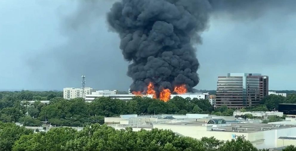 PHOTO: Smoke rises from a building fire in Charlotte, N.C., on May 18, 2023.