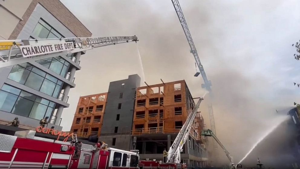 PHOTO: Firefighters work on the scene of a building fire in Charlotte, N.C., on May 18, 2023.