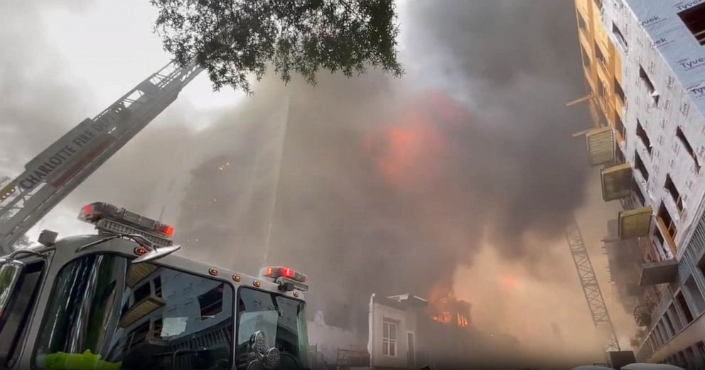 PHOTO: Firefighters work on the scene of a building fire in Charlotte, N.C., on May 18, 2023.