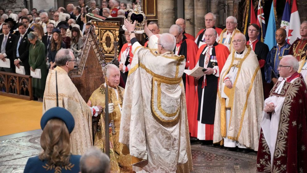 PHOTO: King Charles III sits as he receives The St Edward's Crown during the coronation ceremony at Westminster Abbey, London, Saturday, May 6, 2023. (Jonathan Brady/Pool Photo via AP)
