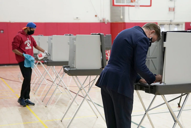 Connecticut Governor Ned Lamont casts his vote at Greenwich High School in Greenwich, Connecticut on November 3, 2020. - The United States started voting Tuesday in an election amounting to a referendum on Donald Trump's uniquely brash and bruising presidency, which Democratic opponent and frontrunner Joe Biden urged Americans to end to restore "our democracy." (Photo by TIMOTHY A. CLARY / AFP) (Photo by TIMOTHY A. CLARY/AFP via Getty Images)