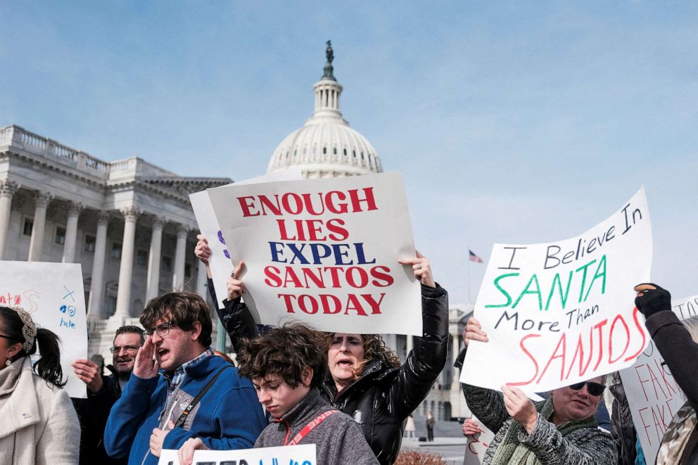 PHOTO: People hold banners on the day of a news conference calling for the resignation of Rep. George Santos at the U.S. Capitol in Washington, D.C., Feb. 7, 2023.