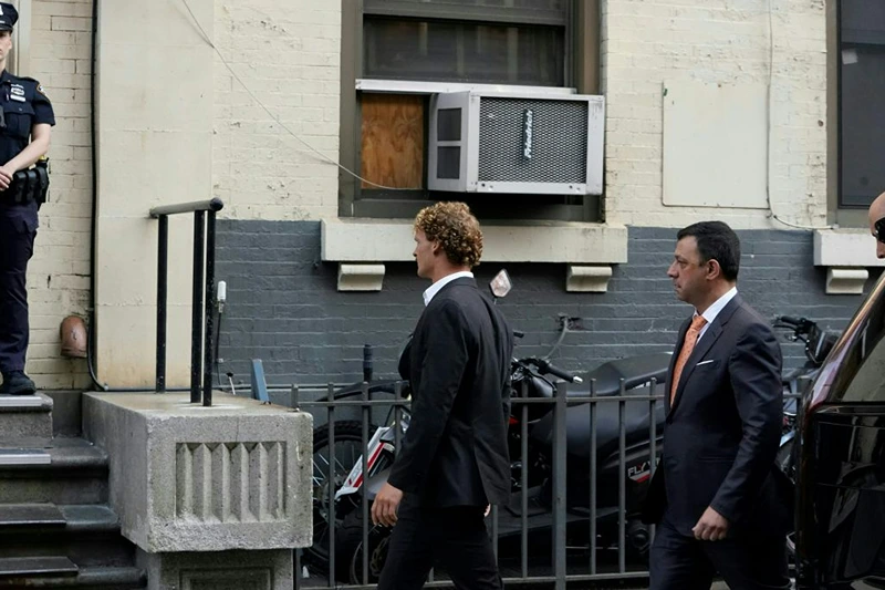 Daniel Penny (C), arrives at the 5th Precinct in New York on May 12, 2023 to turn himself in after being charged with 2nd Degree Manslaughter in the chokehold death of Jordan Neely. The death of Jordan Neely -- widely identified as a Michael Jackson impersonator who often performed on the train -- earlier this month sparked outrage. (Photo by TIMOTHY A. CLARY / AFP) (Photo by TIMOTHY A. CLARY/AFP via Getty Images)