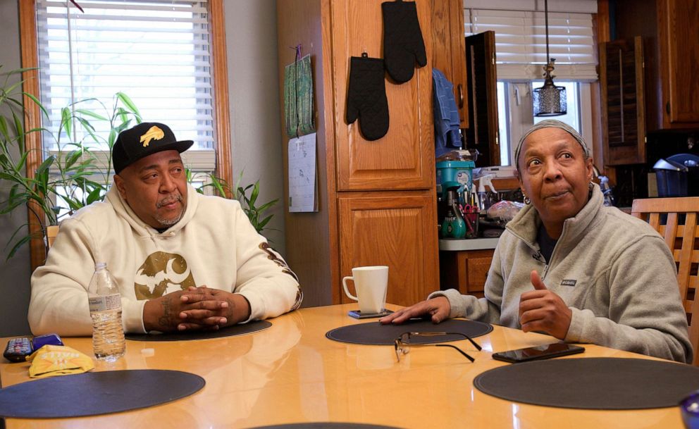 PHOTO: Damone Mapps and his mother, Barbara Mapps Massey, sit around their kitchen table discussing their loved one, Katherine Massey, who was killed in the May 14, 2022, mass shooting at a Tops store on Buffalo's east side.