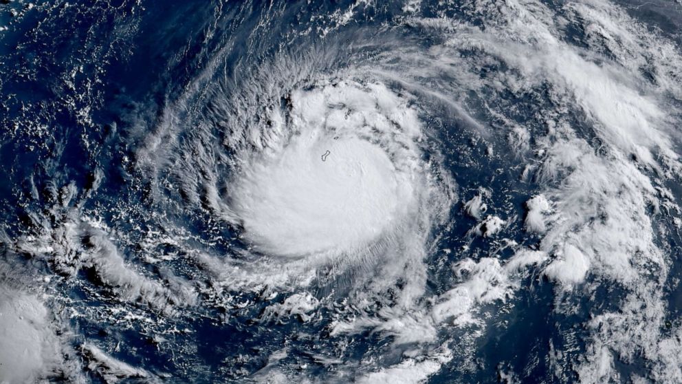 PHOTO: This satellite image obtained from the The National Oceanic and Atmospheric Administration shows Typhoon Mawar, as it approached Guam on May 23, 2023, at 21:50 UTC.