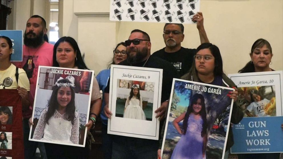 PHOTO: Protesters, some holding photos of victims of the Robb Elementary shooting in Uvalde, gather at the Texas State Capitol in Austin, Texas, May 8, 2023, to call for tighter regulations on gun sales.