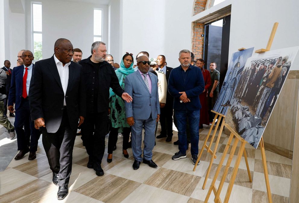 PHOTO: South African President Cyril Ramaphosa, Ukraine's Prosecutor General Andriy Kostin and President of the Union of Comoros Azali Assoumani visit a church at a site of a mass grave, in the town of Bucha, Ukraine, June 16, 2023.