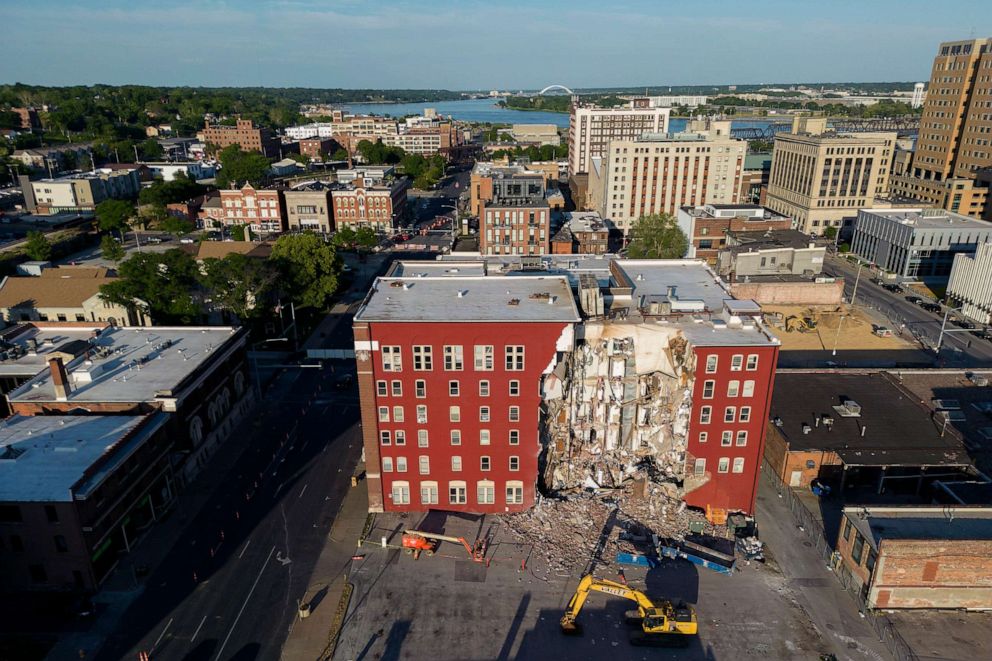 PHOTO: Heavy equipment waits near an apartment building that partially collapsed two days earlier, May 30, 2023, in Davenport, Iowa.