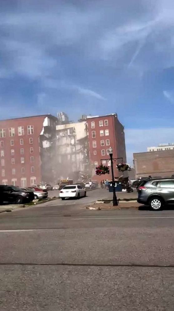 PHOTO: Dust can be seen in the air moments after a building collapsed in Davenport, Iowa, on May 28, 2023.