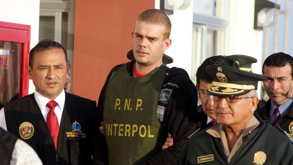 PHOTO: In this June 4, 2010, file photo, Joran van der Sloot is escorted by police after being handed over by Chilean authorities at the border between both countries in Tacna, 1,250 kilometers south of Lima, Peru.