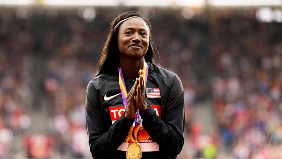 PHOTO: Tori Bowie gestures after receiving the gold medal she won in the women's 100m final during the World Athletics Championships in London, Aug. 7, 2017.