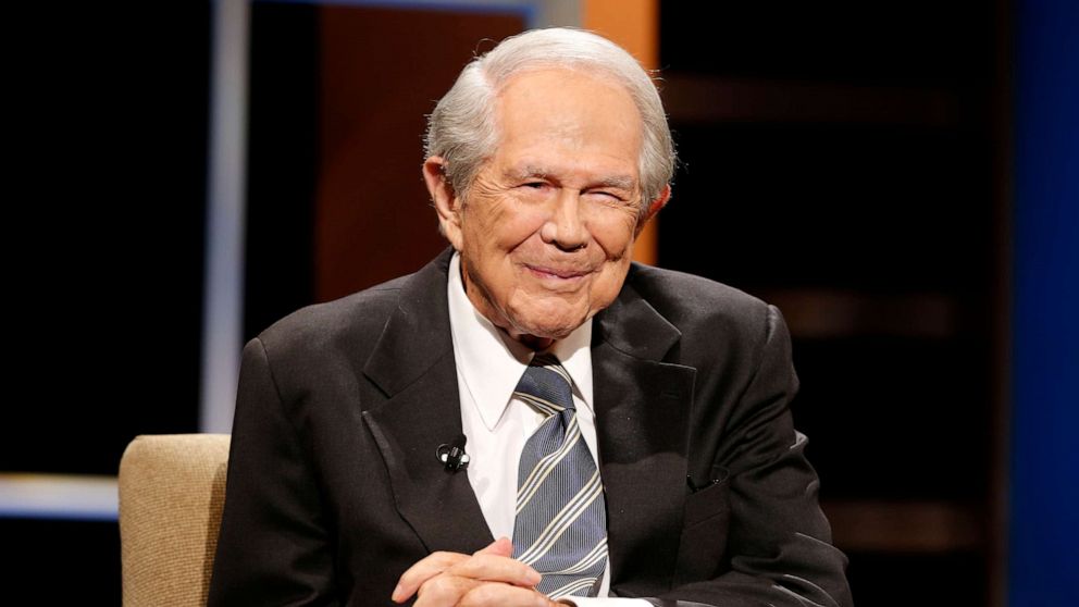 PHOTO: The Rev. Pat Robertson poses a question to a Republican presidential candidate during a forum at Regent University in Virginia Beach, Va., Oct. 23, 2015.