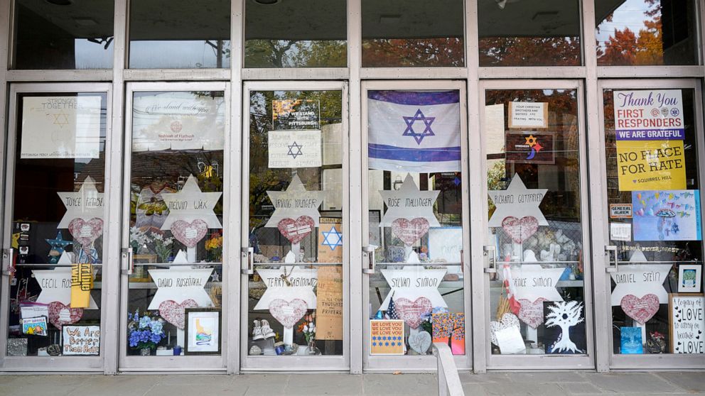 PHOTO: A memorial is placed inside the locked doors of the dormant landmark Tree of Life synagogue in Pittsburgh's Squirrel Hill neighborhood, Oct. 26, 2022.