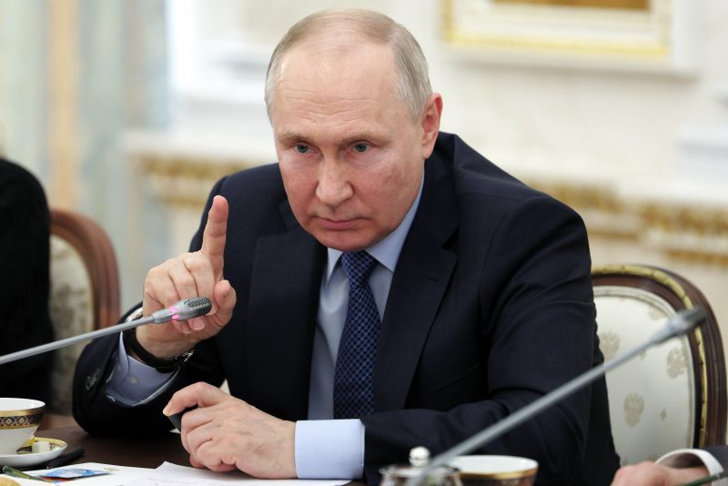 Russian President Vladimir Putin gestures as he speaks during a meeting with Russian war correspondents who cover a special military operation at the Kremlin in Moscow, Russia, Tuesday, June 13, 2023. (Gavriil Grigorov, Sputnik, Kremlin Pool Photo via AP)