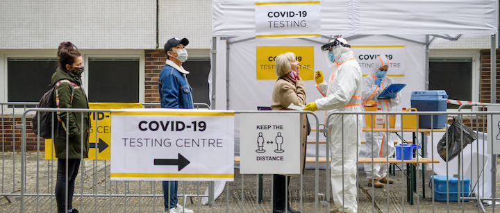 People wait in line for COVID-19 testing