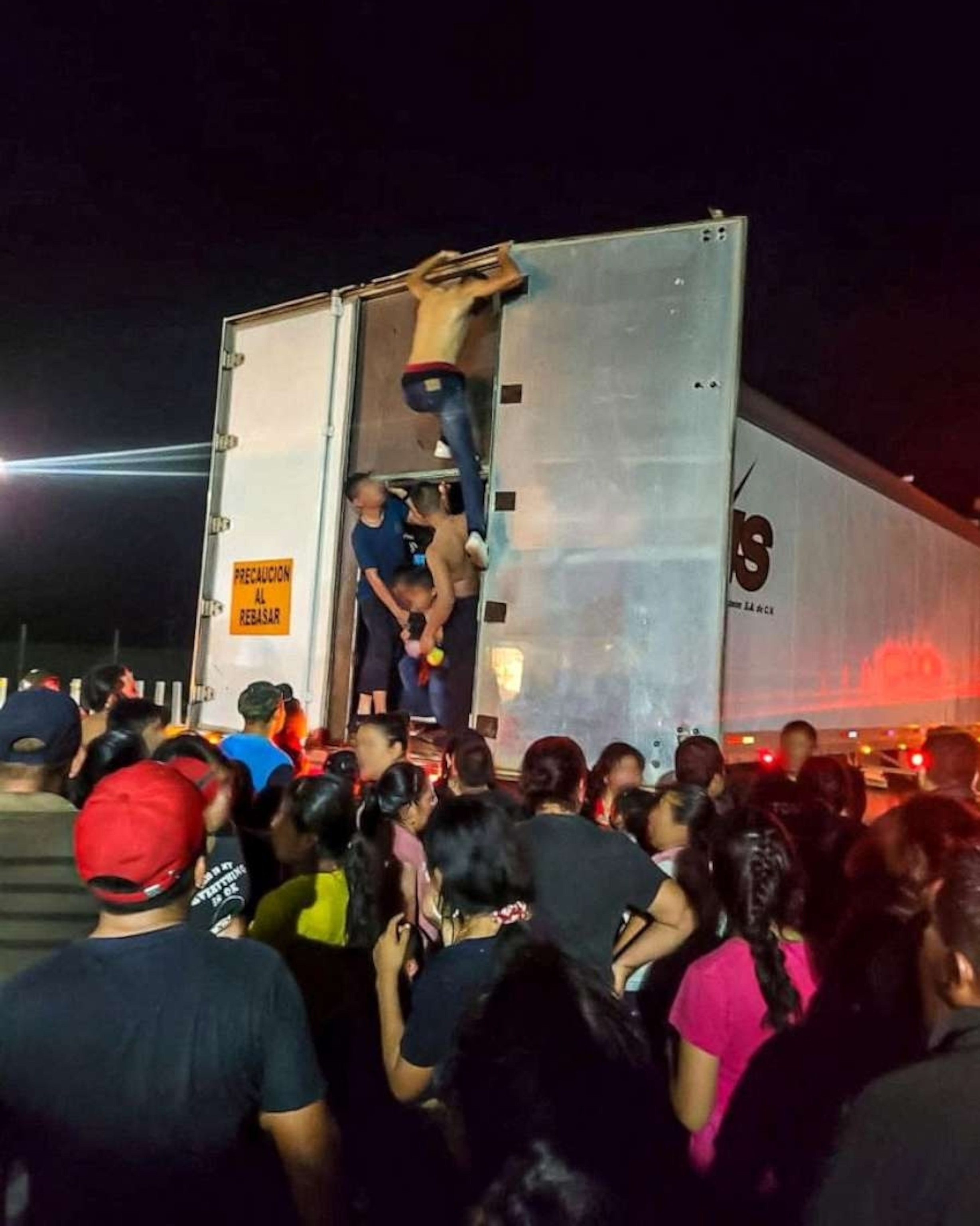 PHOTO: Migrants are rescued by Mexican authorities after being found crammed and dehydrated in a trailer-truck, in Cosamaloapan, in Veracruz state, Mexico, in this handout photo distributed to Reuters on September 14, 2023.