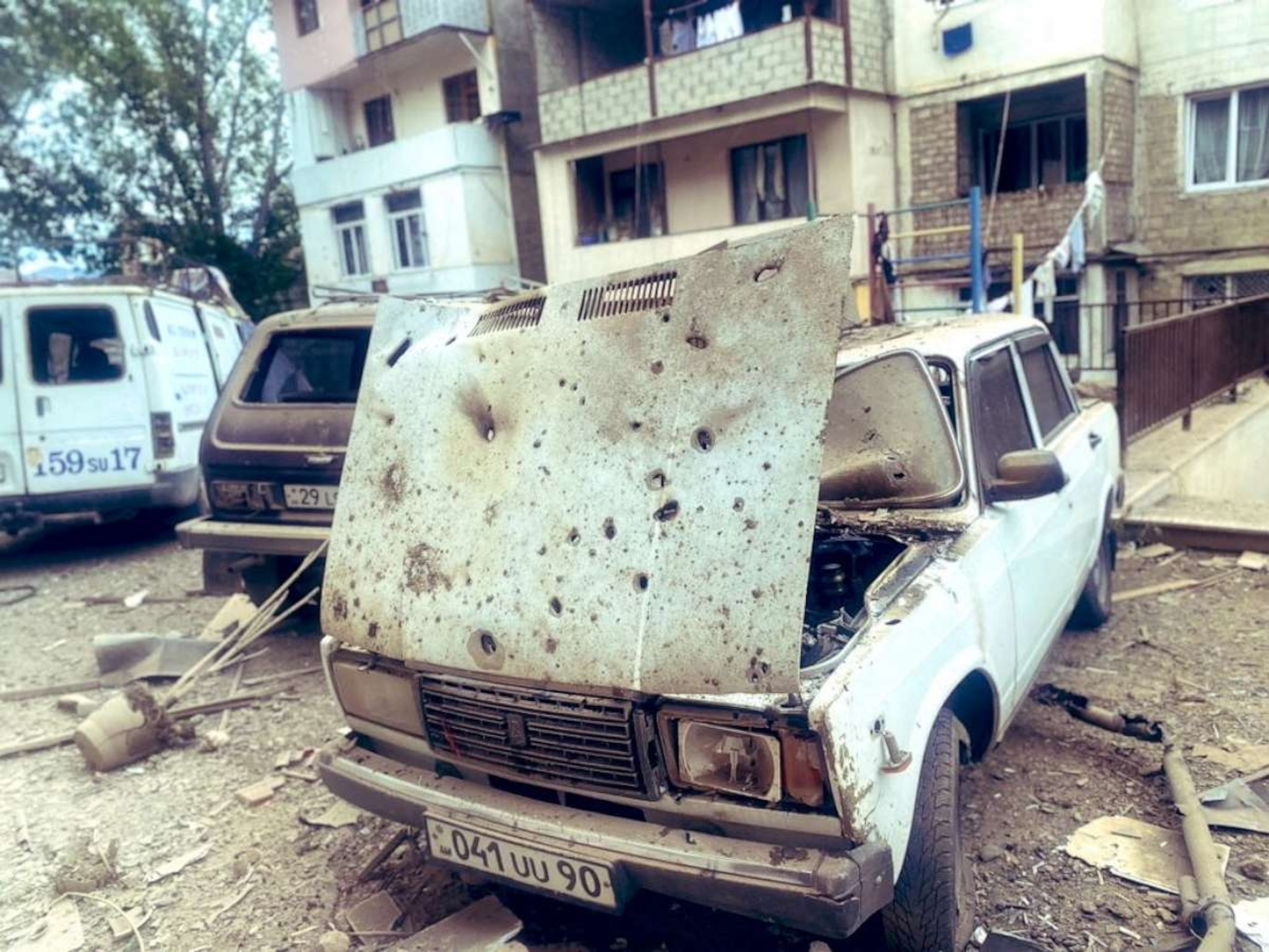 PHOTO: A view shows damaged cars in front of a residential building following the launch of a military operation by Azerbaijani armed forces in the city of Stepanakert in Nagorno-Karabakh, a region inhabited by ethnic Armenians, Sept. 19, 2023.