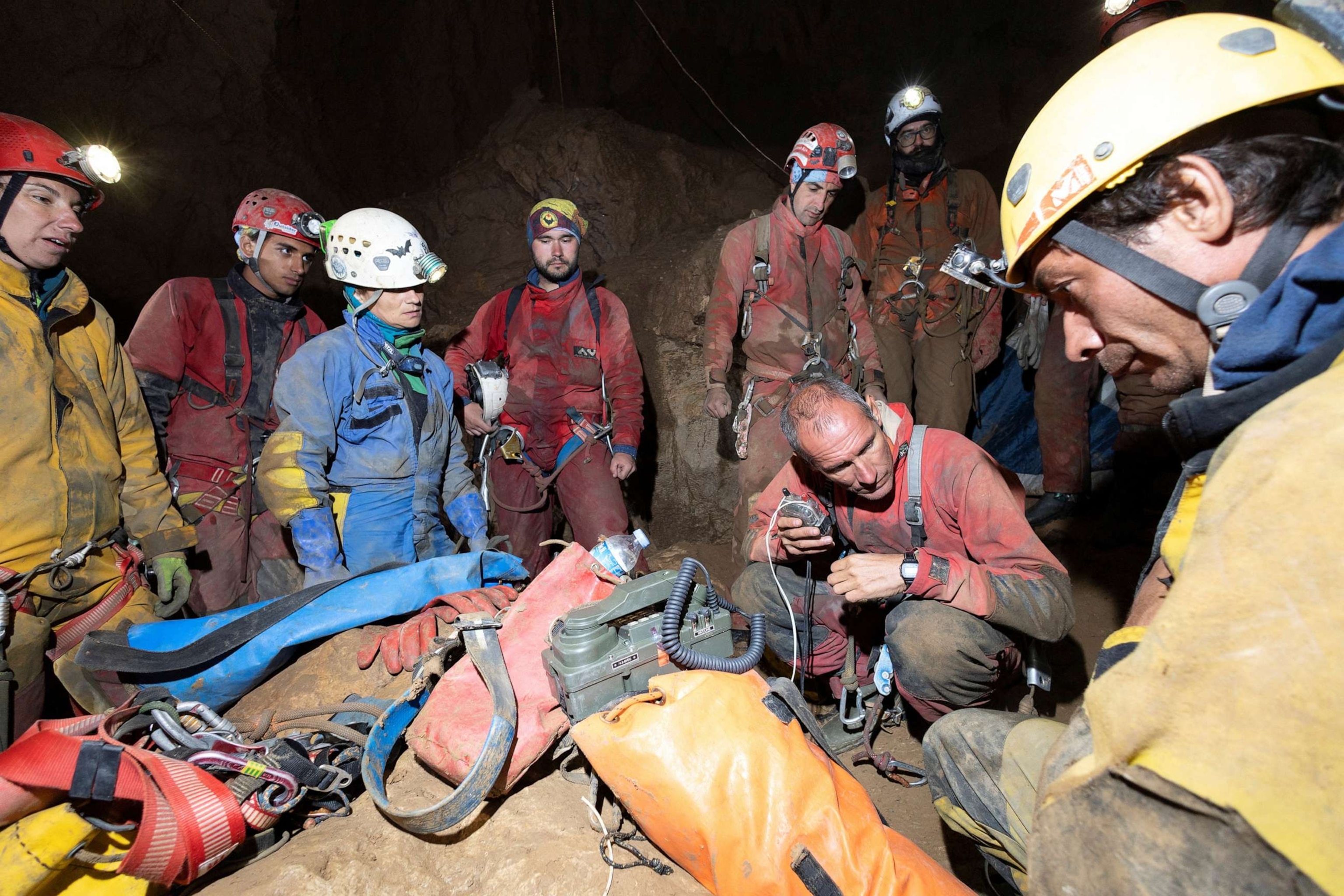 PHOTO: Rescuers gather around a radio in Morca Cave, as they take part in a rescue operation to reach U.S. caver Mark Dickey who fell ill and became trapped some 1,000 meters underground, near Anamur in Mersin province, southern Turkey, Sept. 7, 2023.