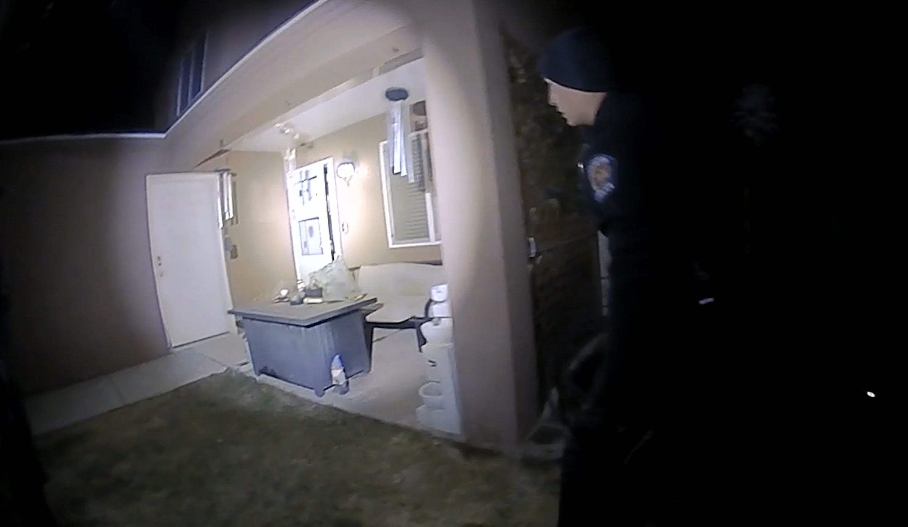 PHOTO: In this screen grab from bodycam footage released by the Farmington Police Department, the homeowner answers the door as a police officer stands in the yard, on April 5, 2023, in Farmington, N.M.