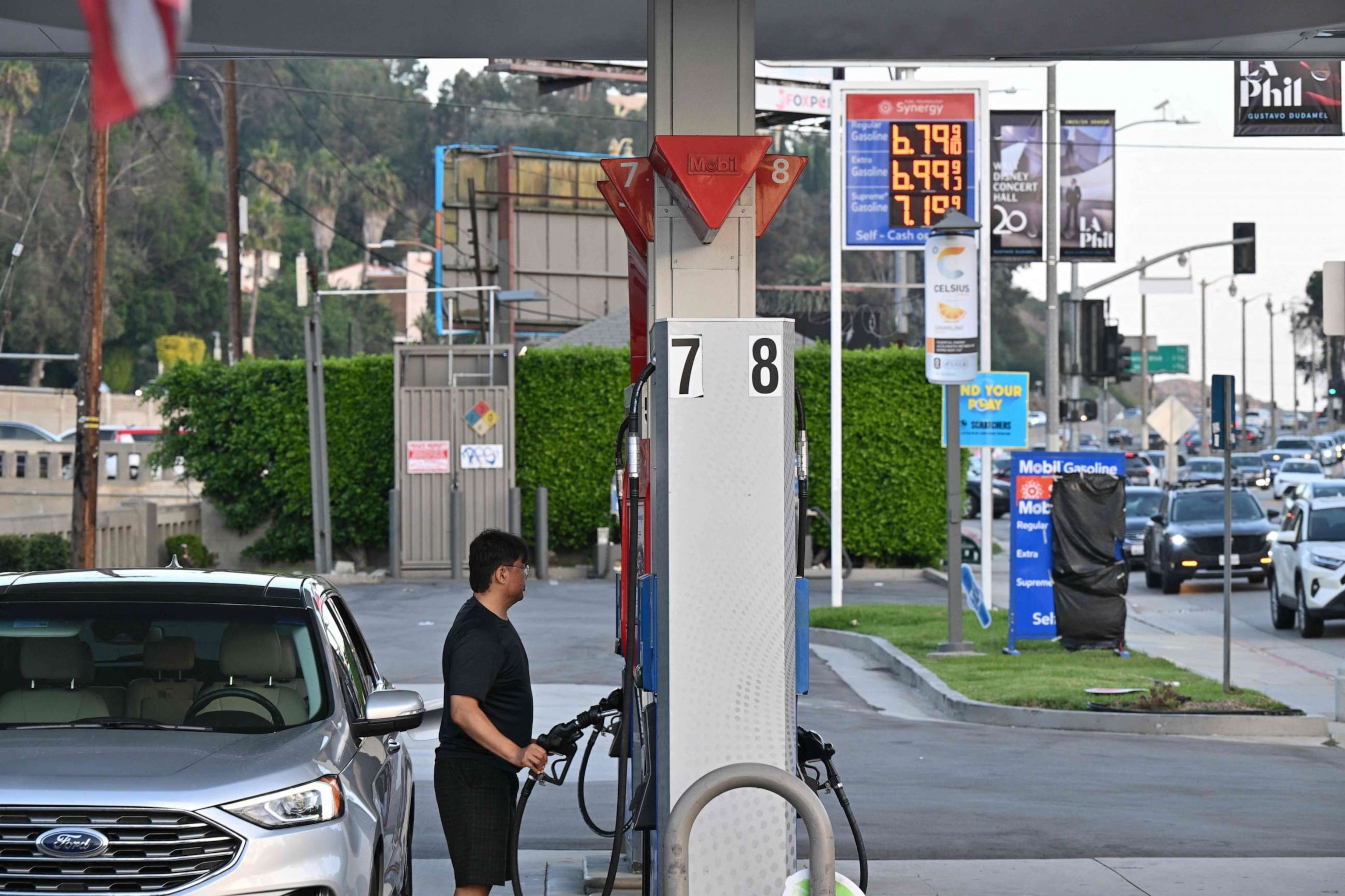 PHOTO: A man pumps gas gas at a station in Los Angeles, Sept. 28, 2023.