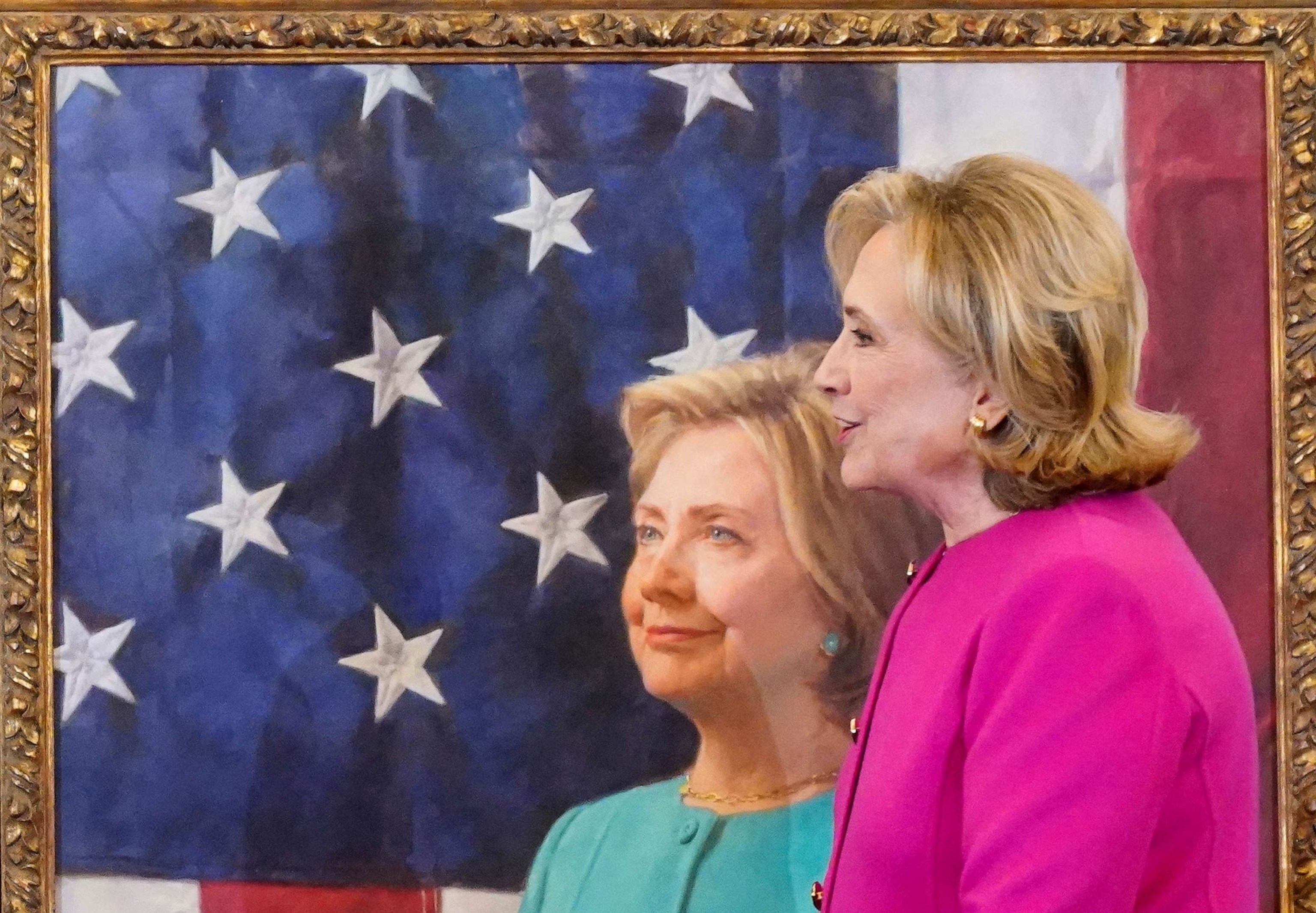 PHOTO: Former Secretary of State Hillary Rodham Clinton stands next to her portrait during its unveiling, at the State Department in Washington, Sept. 26, 2023.